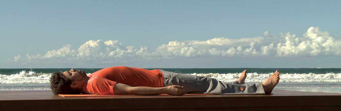 Andrew Wells Dru Yoga teacher trainer, Dru Yoga relaxation, beach