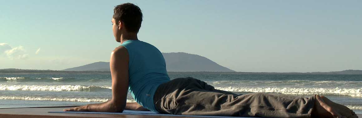 Dru Yoga healthy back sphinx posture, beach