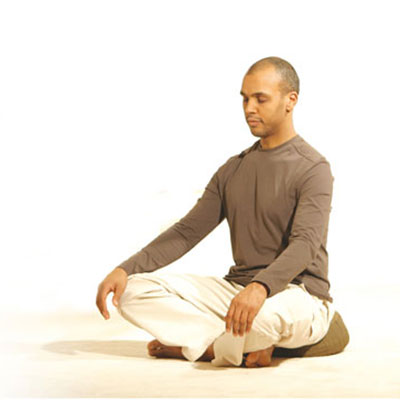 Man peacefully meditating with Dru